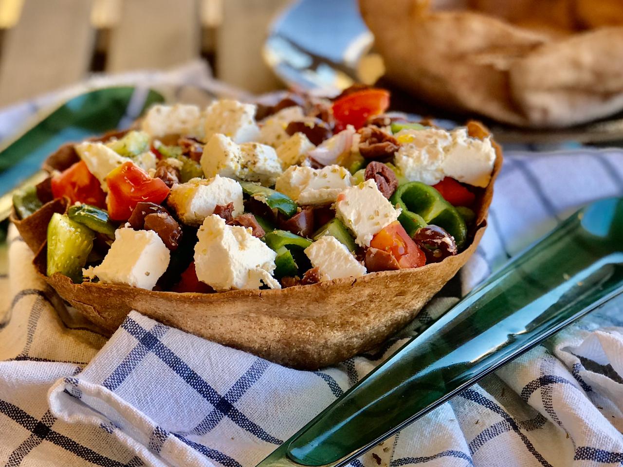 Greek salad in a tortilla bowl